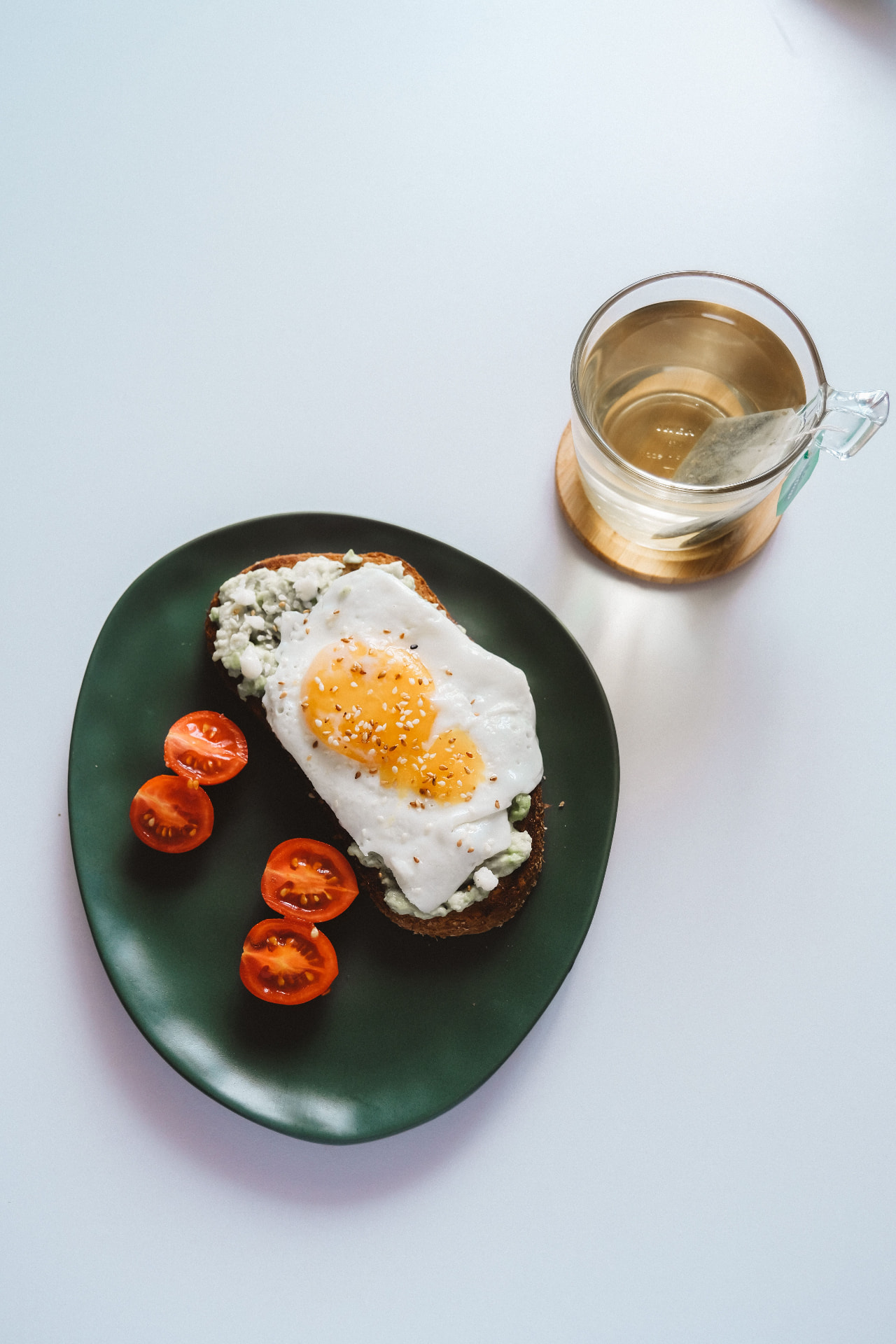 Balanced breakfast with eggs, avocado and tomatoes